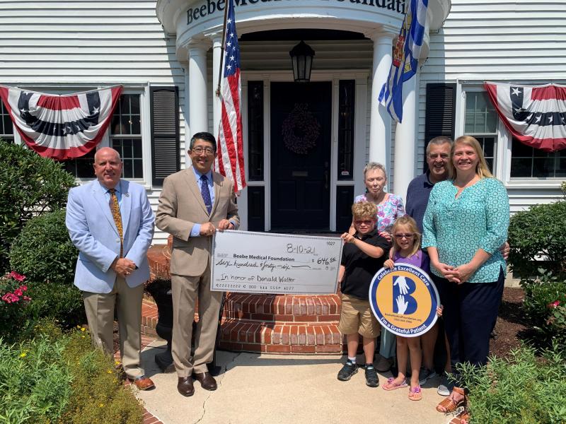 Taking part in the Charlie’s Challenge check presentation are (l-r) Tom Protack, Beebe Medical Foundation president; Dr. David Tam, Beebe Healthcare president and CEO; and Charlie Walter with his grandmother Diane Walter, sister Ayva Veenema, stepdad Ray Veenema, and mother Mary Veenema. SUBMITTED PHOTOS